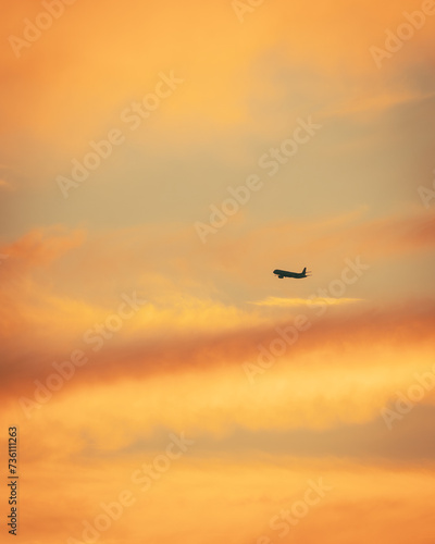 Passengers commercial airplane flying during sunset. The beginning of the holiday trip. © Piotr