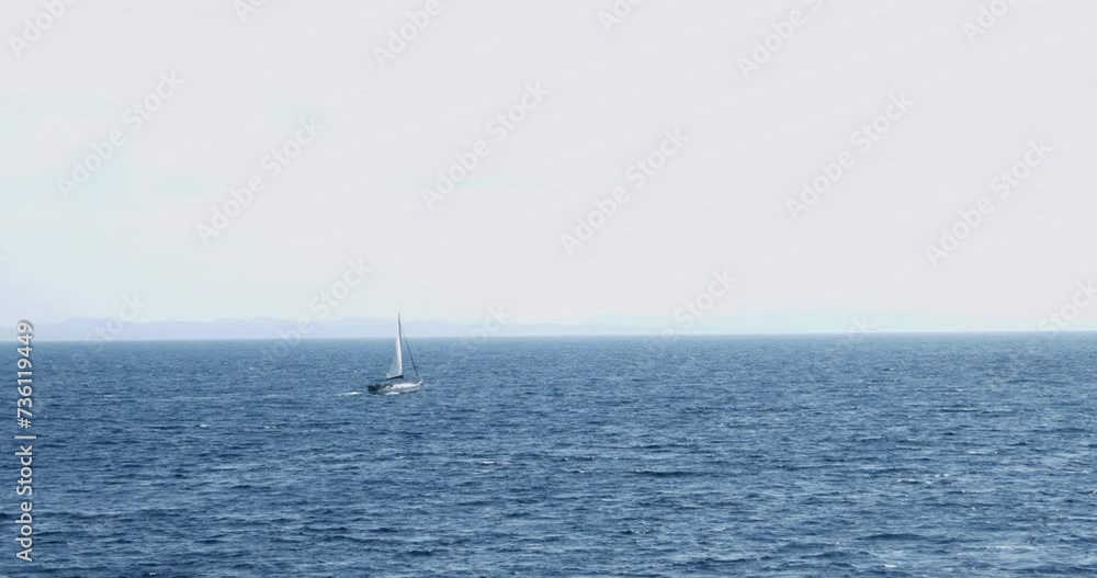 Sailing lboat at open sea in sunshine Sailing lboat at open sea in sunshine
