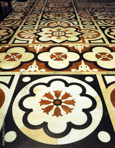Marble pavement mosaic with floral decoration at interior of the gothic Cathedral of Milan (Duomo de Milano), Lombardy, Italy