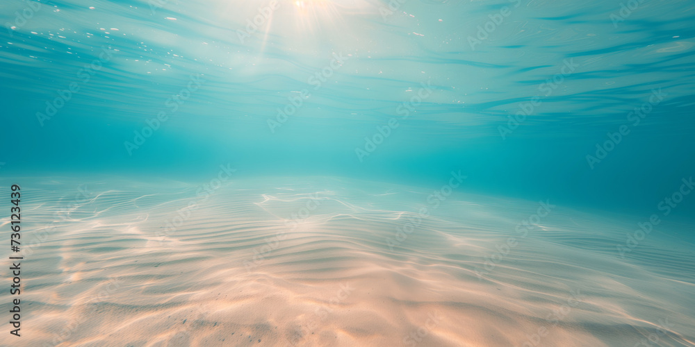 Seabed sand with blue tropical ocean above, empty underwater background with the summer sun shining brightly, creating ripples in the calm sea water - obrazy, fototapety, plakaty 