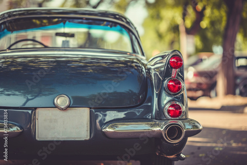 Vintage car with iconic tail lights parked outdoors