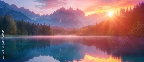 Calm morning view of Fusine lake. Colorful summer sunrise in Julian Alps with Mangart peak on background, Province of Udine, Italy, Europe. Beauty of nature concept background #736148245