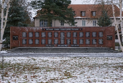 Zeuthen, Germany - Jan 22, 2024: This Red Army war cemetery contains a mass grave with 449 Soviet soldiers who were killed in 1945 during Second World War. Cloudy winter day. Selective focus photo