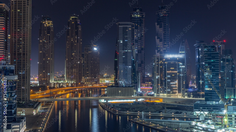 Cityscape with skyscrapers of Dubai Business Bay and water canal aerial all night timelapse. Cityscape with skyscrapers of Dubai Business Bay and water canal aerial all night timelapse.