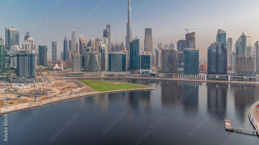 Fototapeta premium Aerial view to Dubai Business Bay and Downtown with the various skyscrapers and towers timelapse