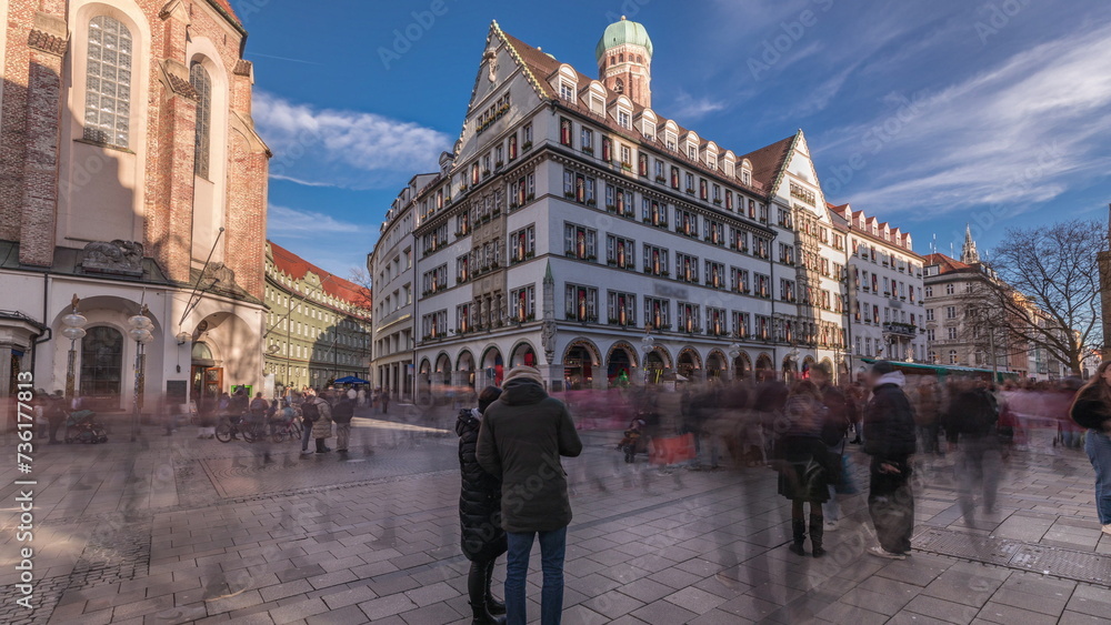 Fototapeta premium Kaufingerstrasse, shopping street and pedestrian zone in Munich downtown near the Marienplatz timelapse. Bavaria, Germany