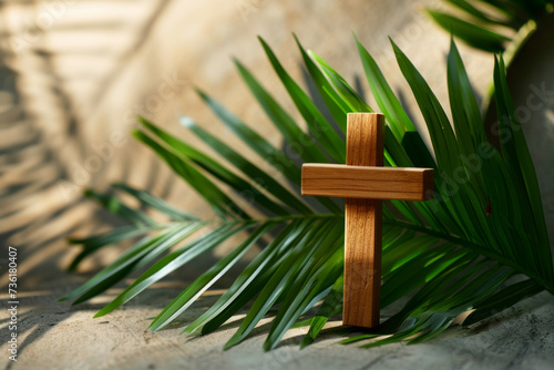 Palm Sunday background Wooden cross and palm leaves on neutral background with copy space for text. Christianity, faith, religious, Holy Week concept photo