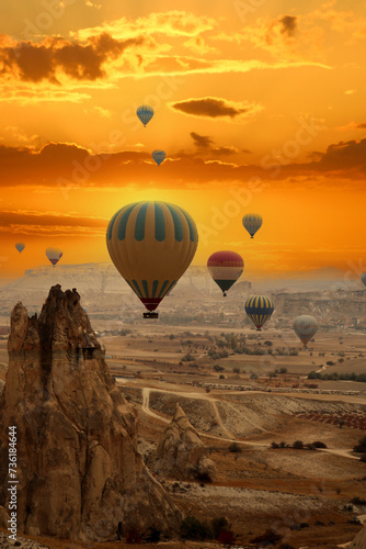 Flying hot air balloons in Cappadocia. Nevsehir,Turkey. Amazing sunset and sky.