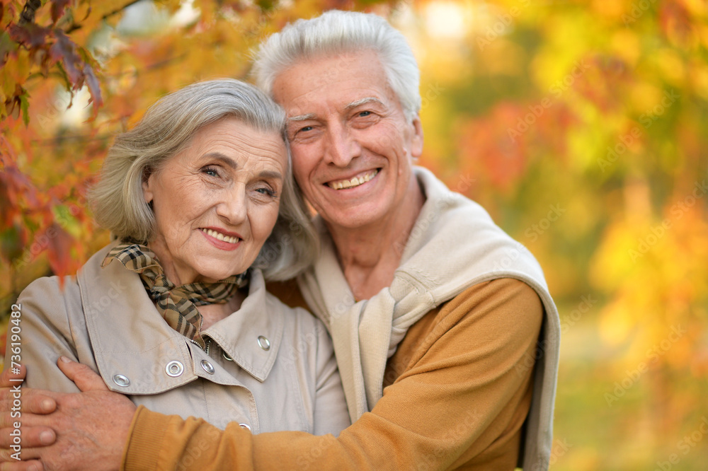 Portrait of happy senior couple in autumn park Portrait of happy senior couple in autumn park