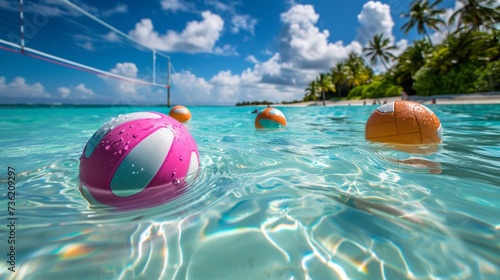 A set of brightly colored beach volleyball floats lazily in the crystal-clear waters of a tropical paradise, waiting for a friendly game to commence photo