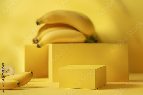 Yellow mockup with rectangular podiums and fresh bananas for cosmetic products