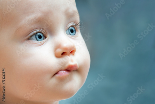 Close up of a baby face with blue eyes