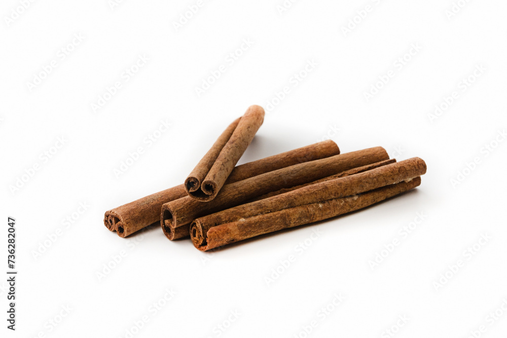 Four cinnamon sticks on a white background. Isolated Four cinnamon sticks on a white background. Isolated