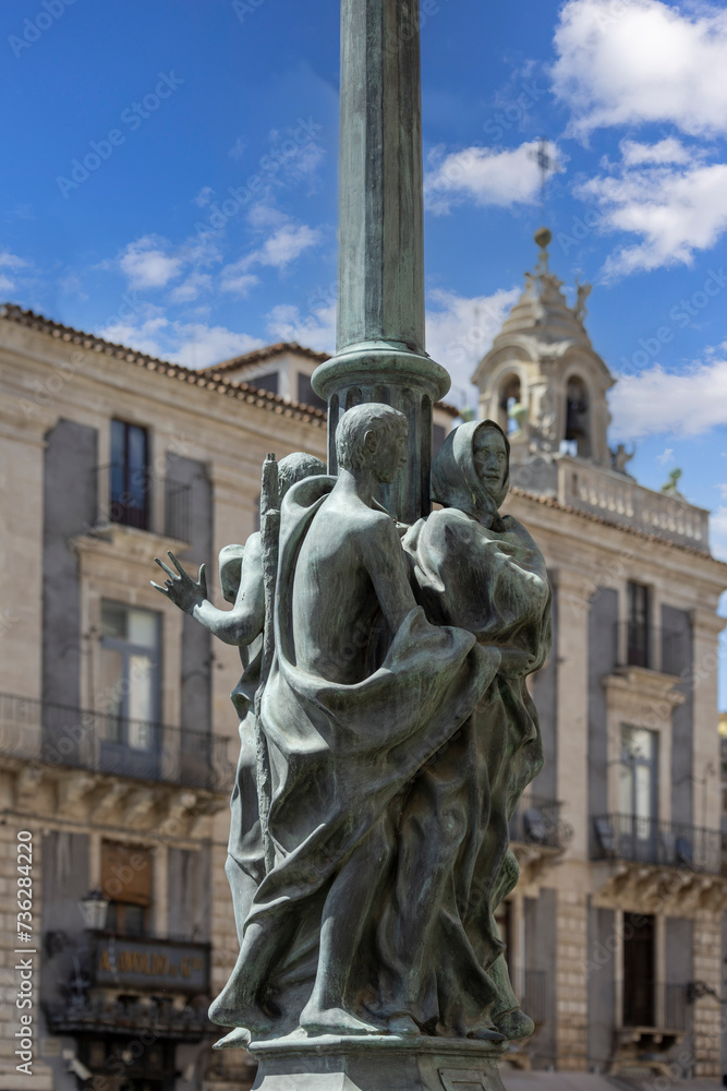 Statues of Fratelle Pii on a street lamp on University Square, Catania, Sicily, Italy