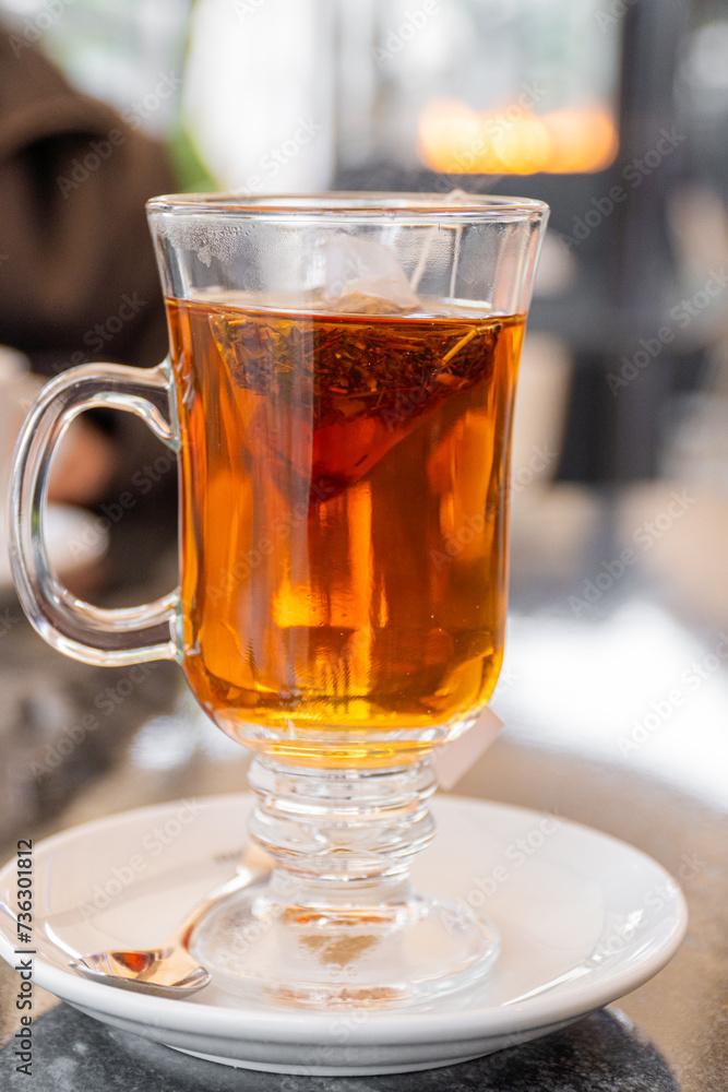 Glass with hot tea infusion Glass with hot tea infusion