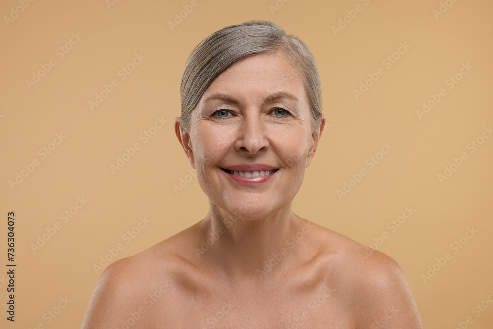 Beautiful woman with healthy skin on beige background Beautiful woman with healthy skin on beige background