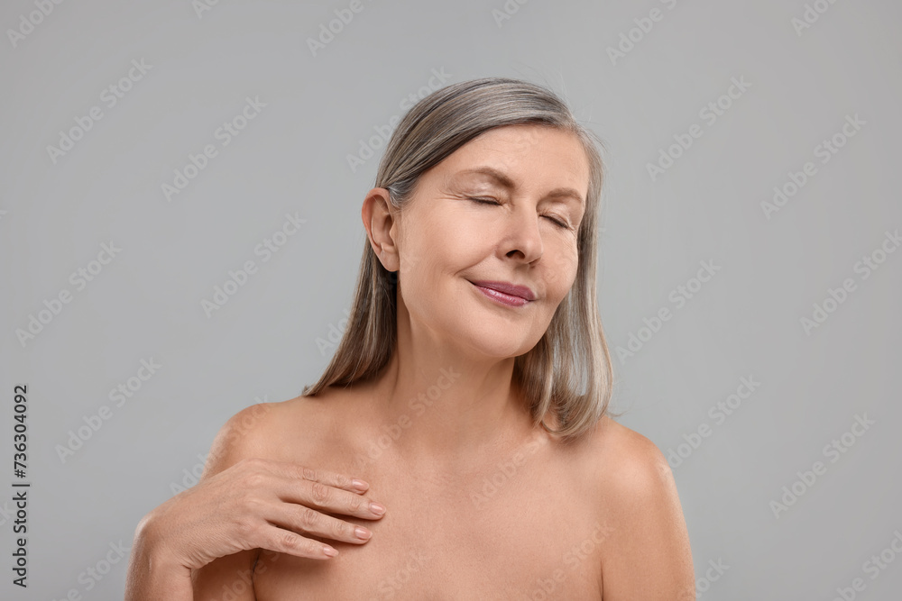 Beautiful woman with healthy skin on grey background Beautiful woman with healthy skin on grey background