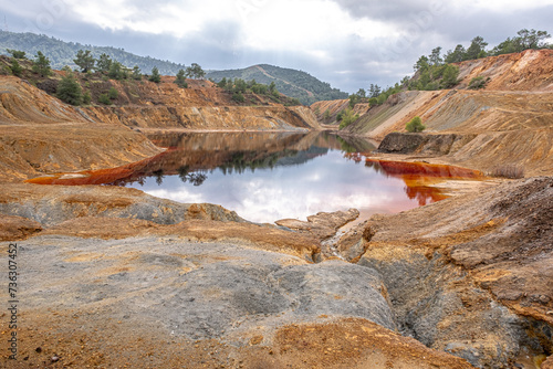 Colorful view of Sia Mine Red Lake, a former copper and pyrite mine excavation basin filled with water, forming an impressive location, located near Sia Village, Nicosia district, Cyprus
