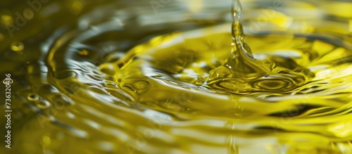 Olive oil mixed with water, forming a small pool.