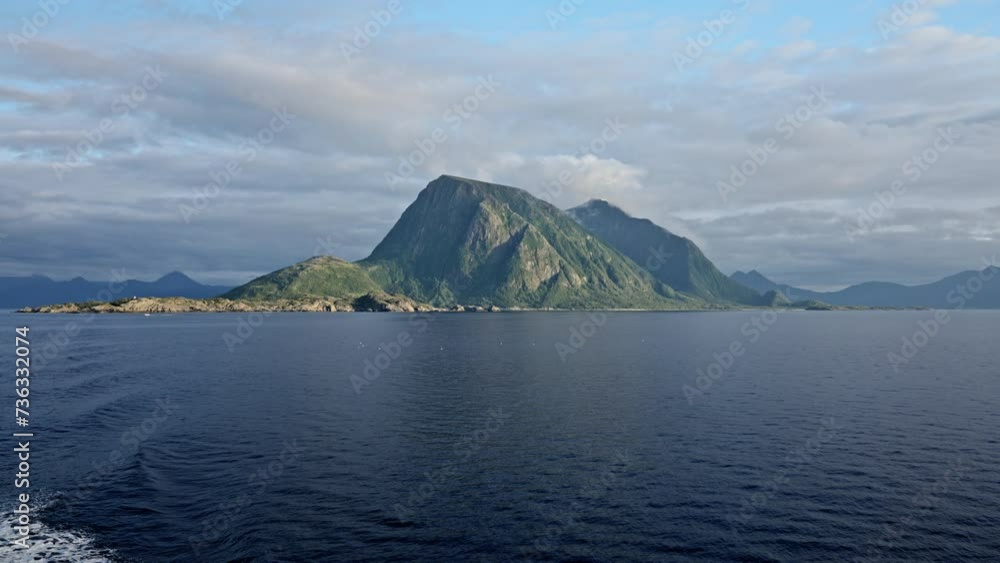 Ferry Journey Amidst Green Mountain Peaks