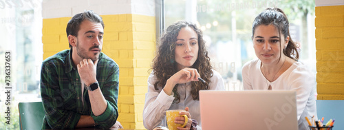 Obraz na płótnie Horizontal banner or header with university students studying together on a new project in creative coworking classroom - Bright filter with focus on woman on center