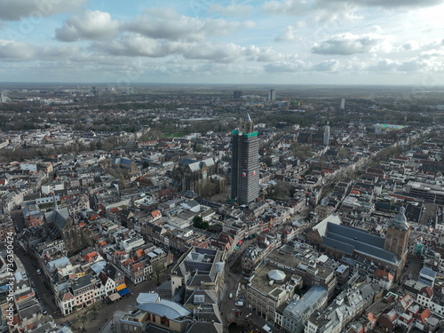 Aerial drone view on the Utrecht Cathedral in scaffolding for renovation. Gothic church in the middle of the Dutch city of Utrecht . Monument and city centre landmark. Birds eye aerial drone view.