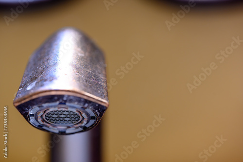 Underside of a bathroom sink aerator on a faucet.