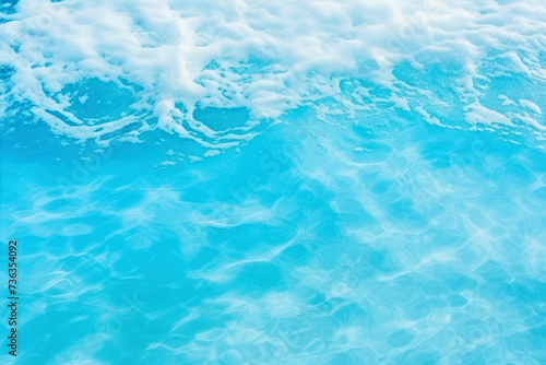 Blue sea water with foam as abstract background. Top view.