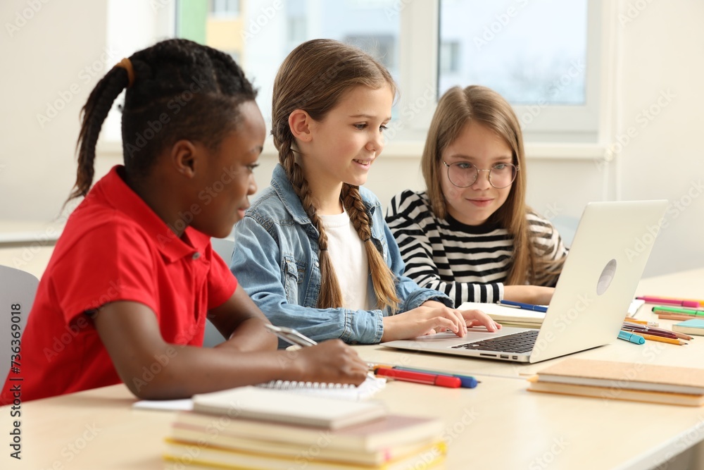 Cute children studying in classroom at school Cute children studying in classroom at school