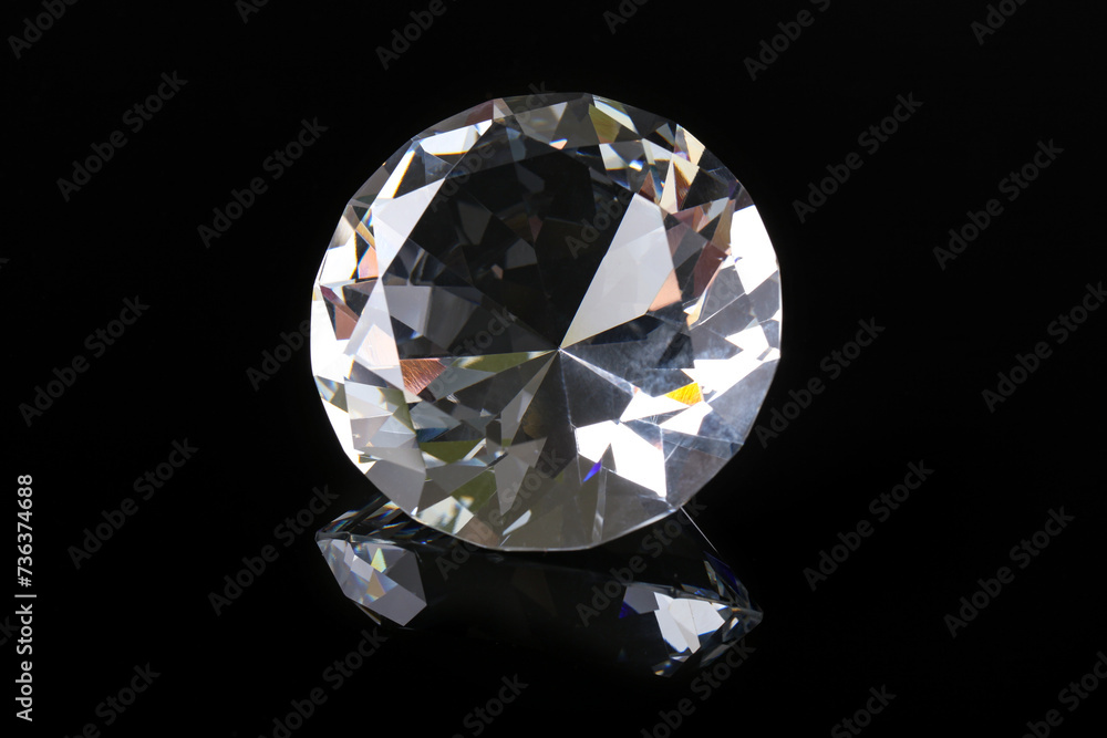 Beautiful shiny diamond on black mirror surface, closeup Beautiful shiny diamond on black mirror surface, closeup