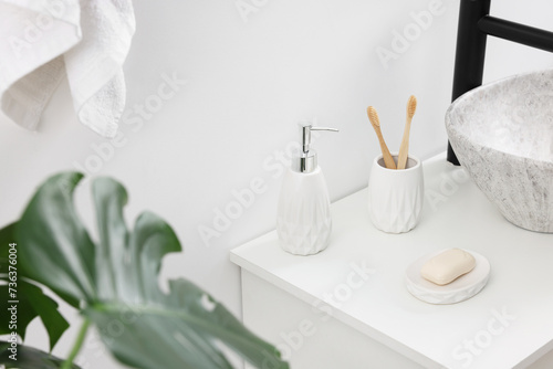 Different bath accessories and personal care products in bathroom