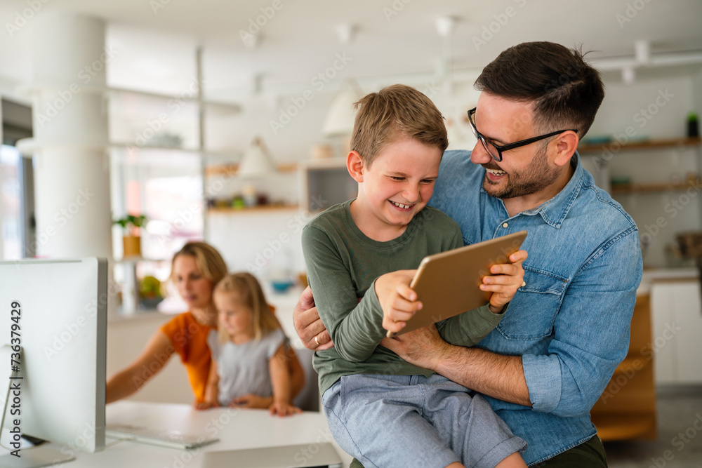 Father and child using digital tablet for e-learning. Education home digital device kid concept. Father and child using digital tablet for e-learning. Education home digital device kid concept.