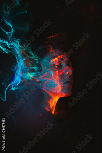 a portrait of a man using their imagination. represented in bright vibrant colors projected on their face and smoke. over a dark background
