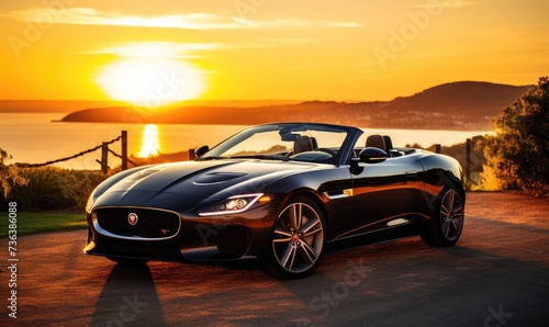 Black Sports Car Parked in Front of a Sunset