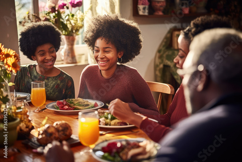 Afro-American family grandfather, grandchildren having breakfast lunch together. Spring time, easter, cosy kitchen dinning room. Happy together festive Sunday, cheerful atmosphere Copy space design