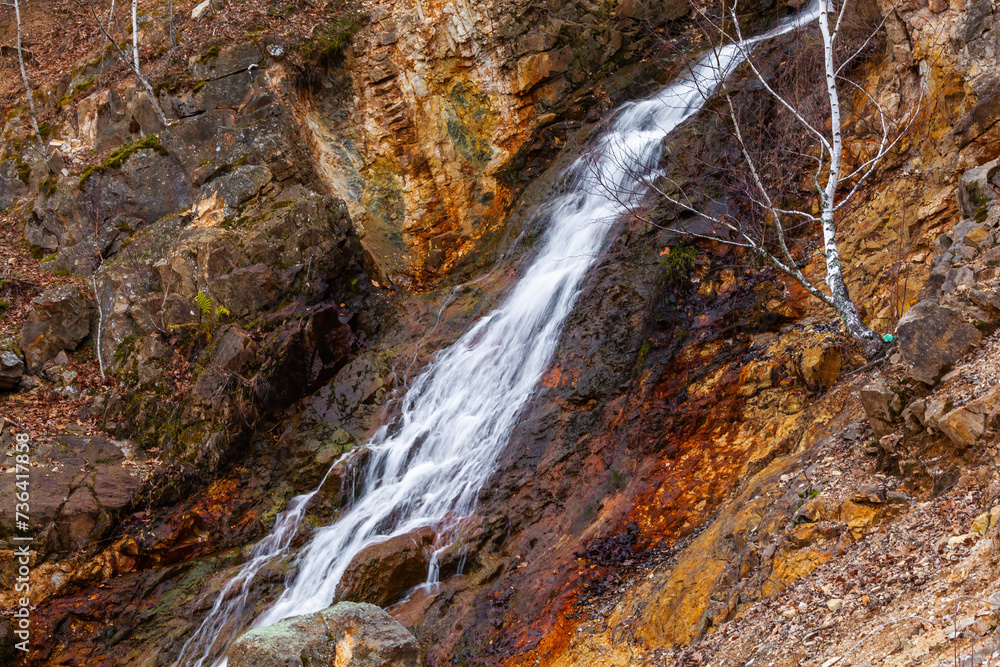 Obraz premium Scenic waterfall in slow motion flow