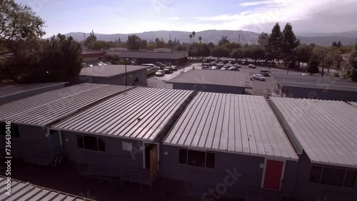 Wallpaper Mural Aerial: Warehouses By Mountains In City Under Cloudy Sky, Drone Flying Backwards On Sunny Day - San Jose, California Torontodigital.ca