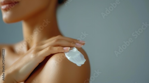 Unrecognized young woman applying lotion in her shoulder against a clean backdrop, Generative AI.