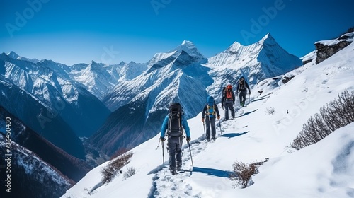 A Group of People Walking Up the Side of a Snow Covered Mountain © Andrii