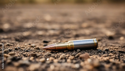 brass bullet on the ground - violence, soldier, war or military concept. 