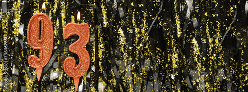 Burning red birthday candles on glitter tinsel background, number 93. Banner.