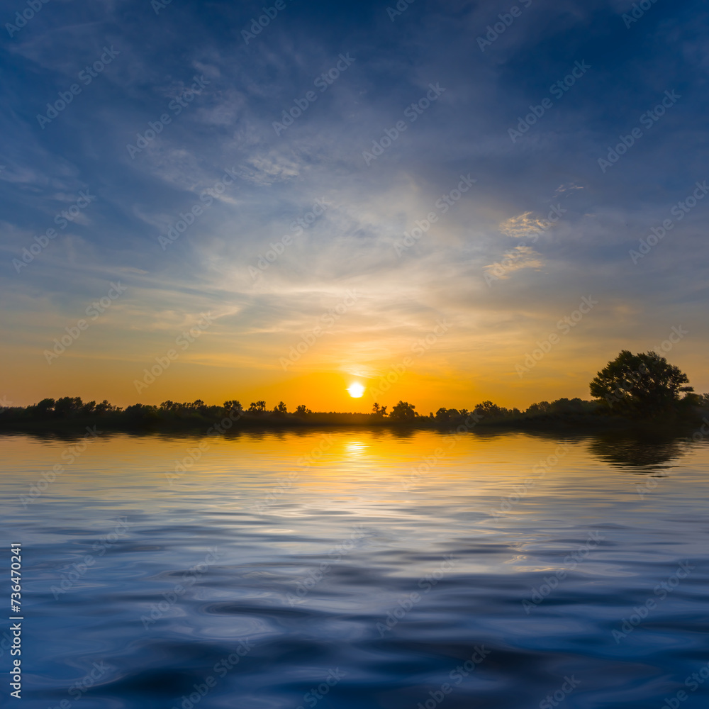 calm lake at the dramatic sunset