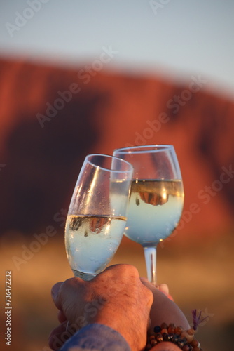 Obraz na płótnie A glass of white wine at Uluru, Ayers Rock in the outback of Australia