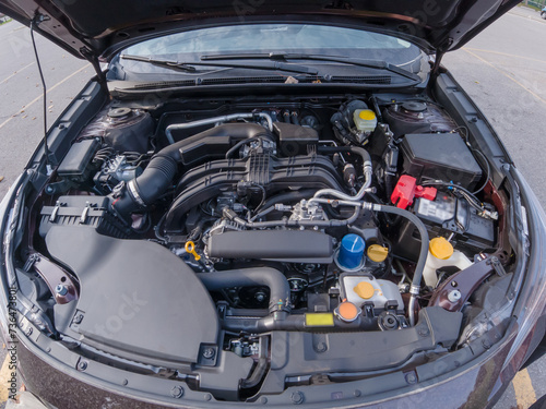 Car engine inspection before purchase. Pre purchase or pre delivery engine compartment check. Service in garage or shop. Certification of used car or vehicle for sale, trade in or financing. © desertsands