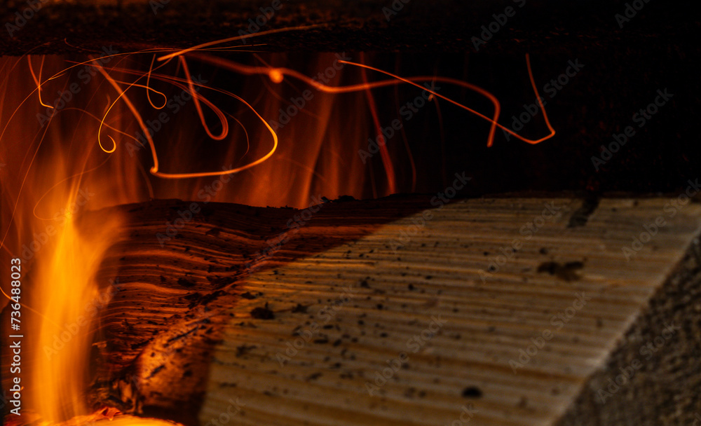 Trajectory of burning log particles