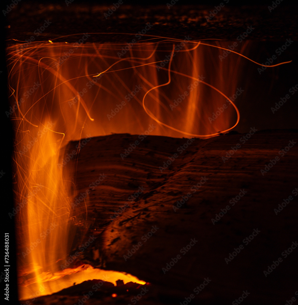 The process of burning part of a log in a stove