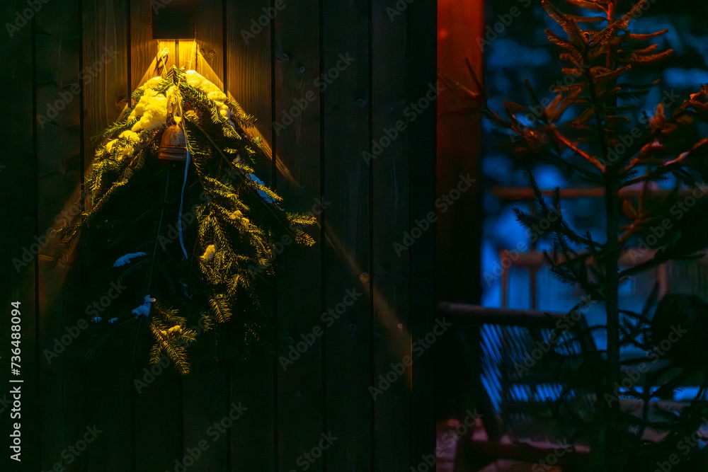 Christmas wreath hanging on the door of a house