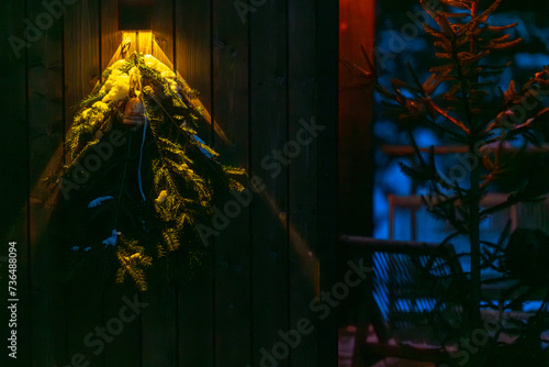 Obraz na płótnie Christmas wreath hanging on the door of a house w salonie
