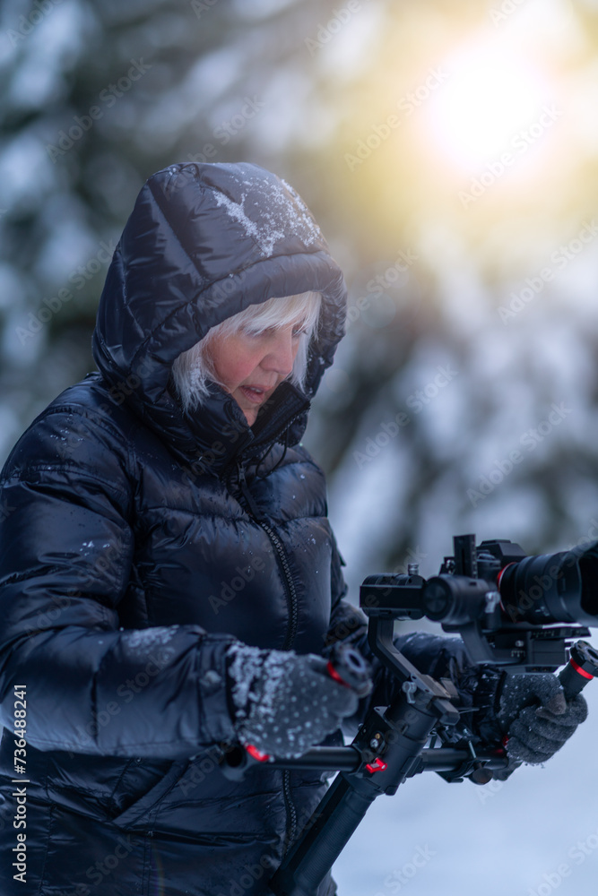 A woman operator monitors the camera operation