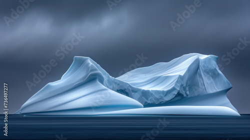 Iceberg in cold sea  dramatic lighting